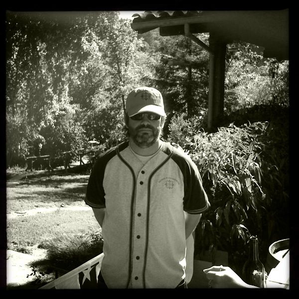 A man wearing a baseball jersey.