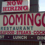 A sign for los domingos restaurant.
