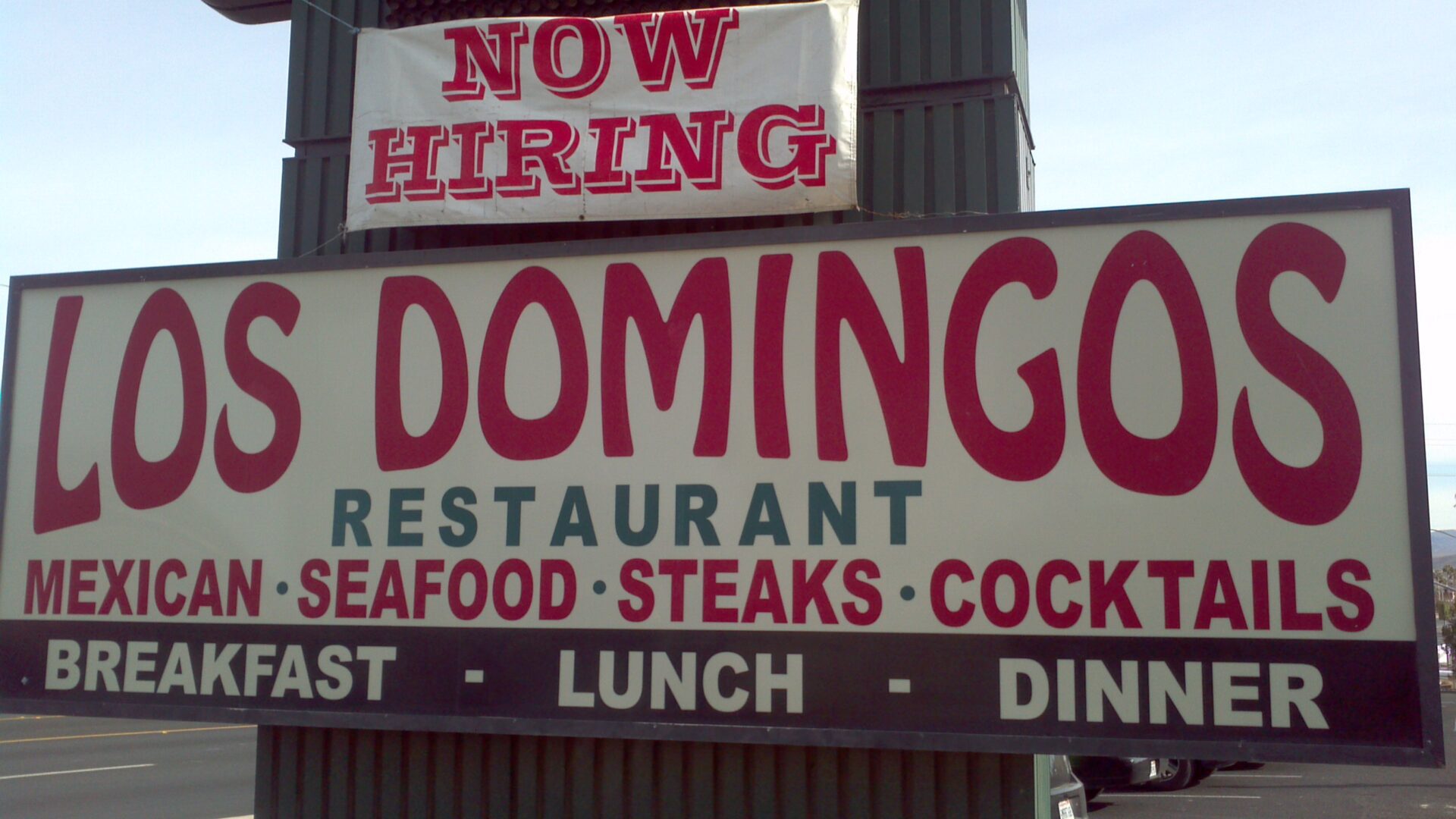 A sign for los domingos restaurant.
