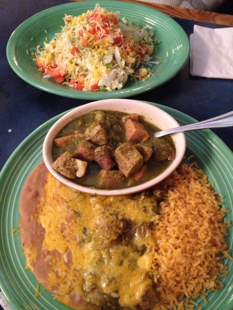 A green plate with food on it.