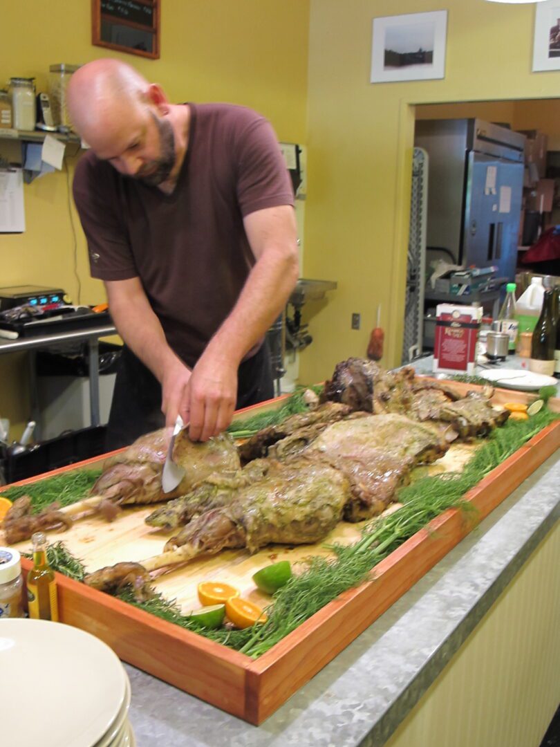 A man slicing meat.