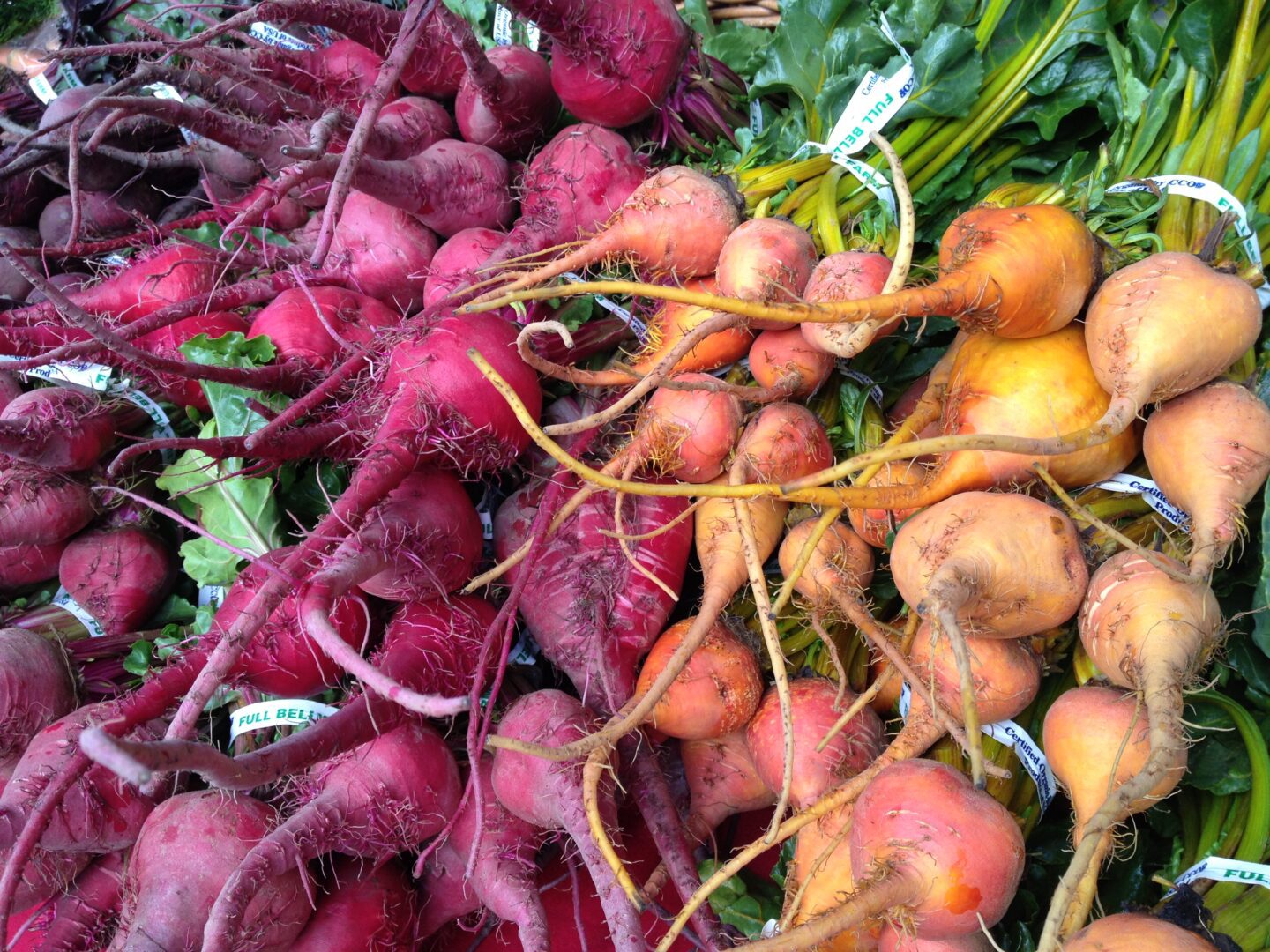 A bunch of beets on a table.