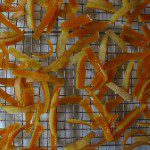 Orange peels on a cooling rack.