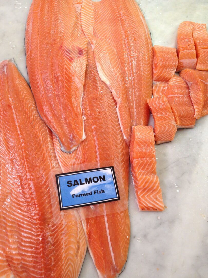 Fresh salmon fillets on a counter.