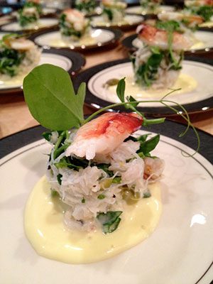 A plate of shrimp and greens on a plate.