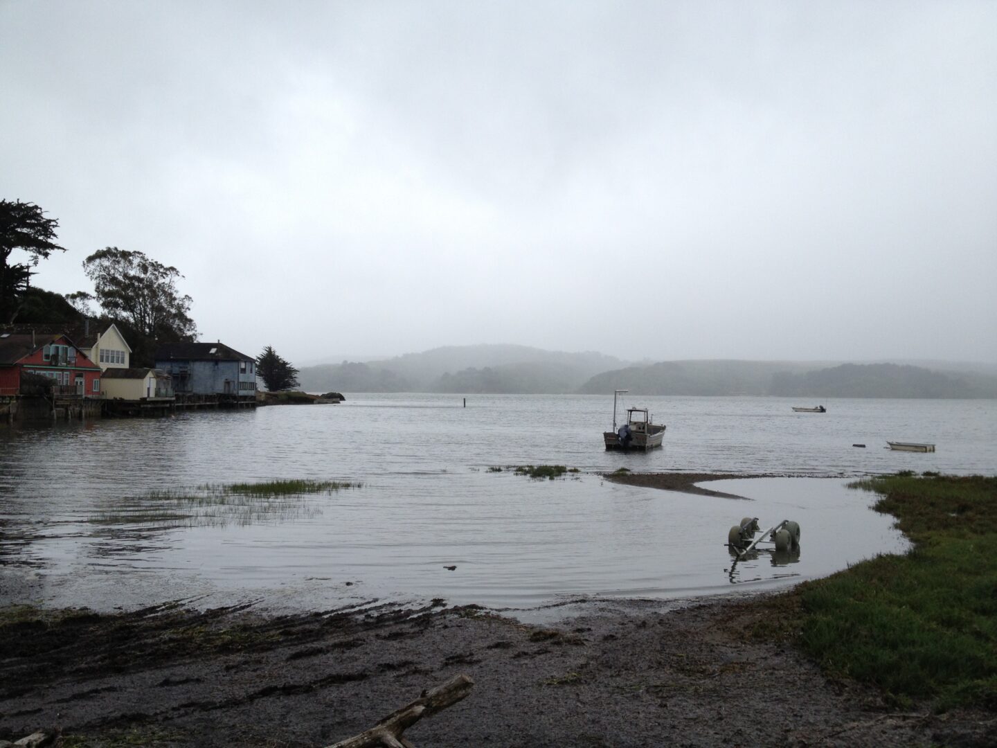 A boat is docked in a body of water.