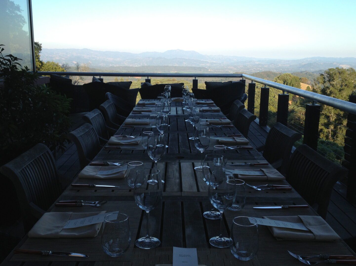 A wooden table on a deck.