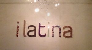 A sign that says latina on the wall of a restaurant.