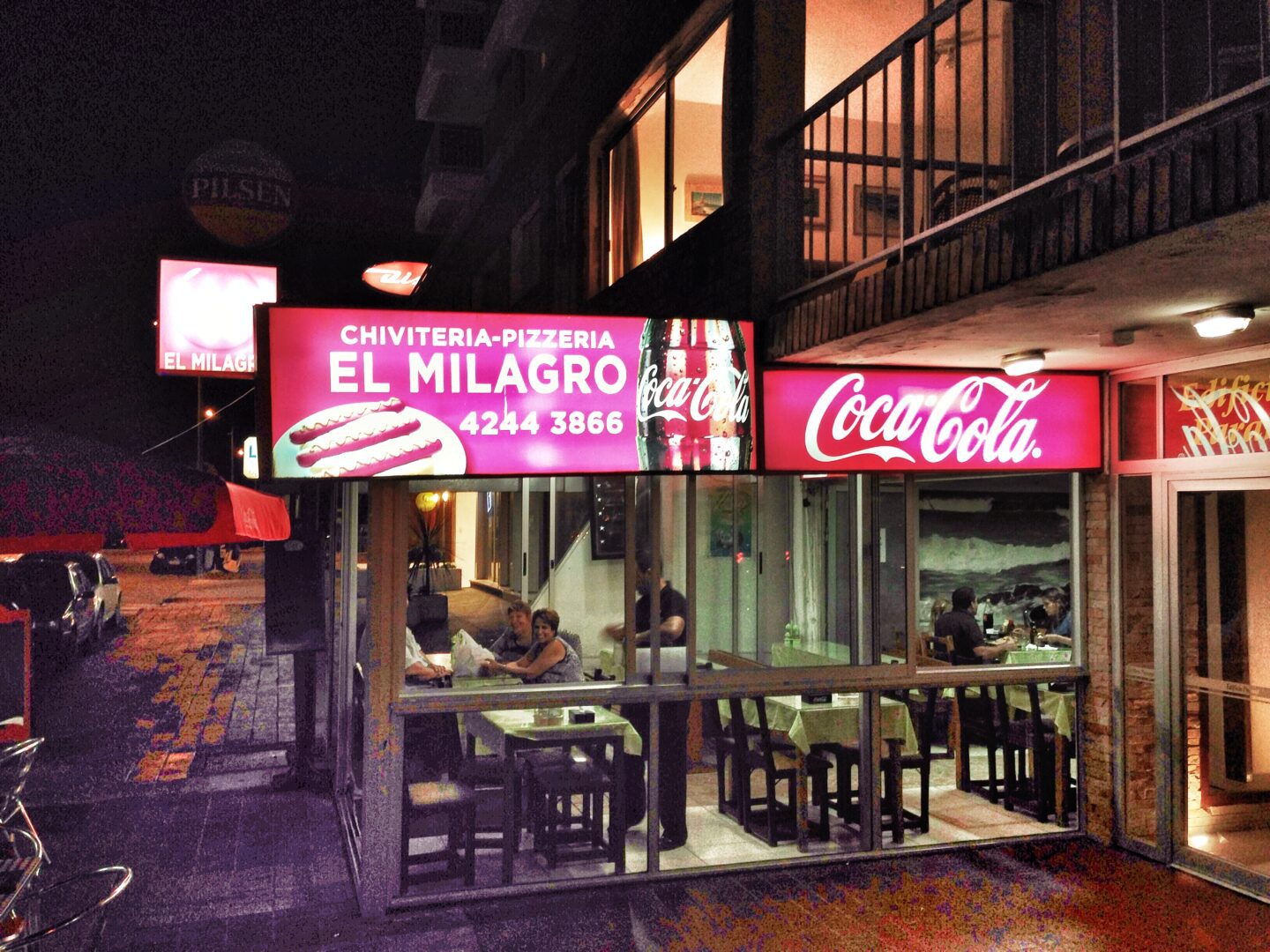 A restaurant with a sign that says el milagro.