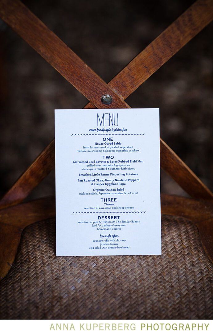 A wedding menu sitting on a chair.