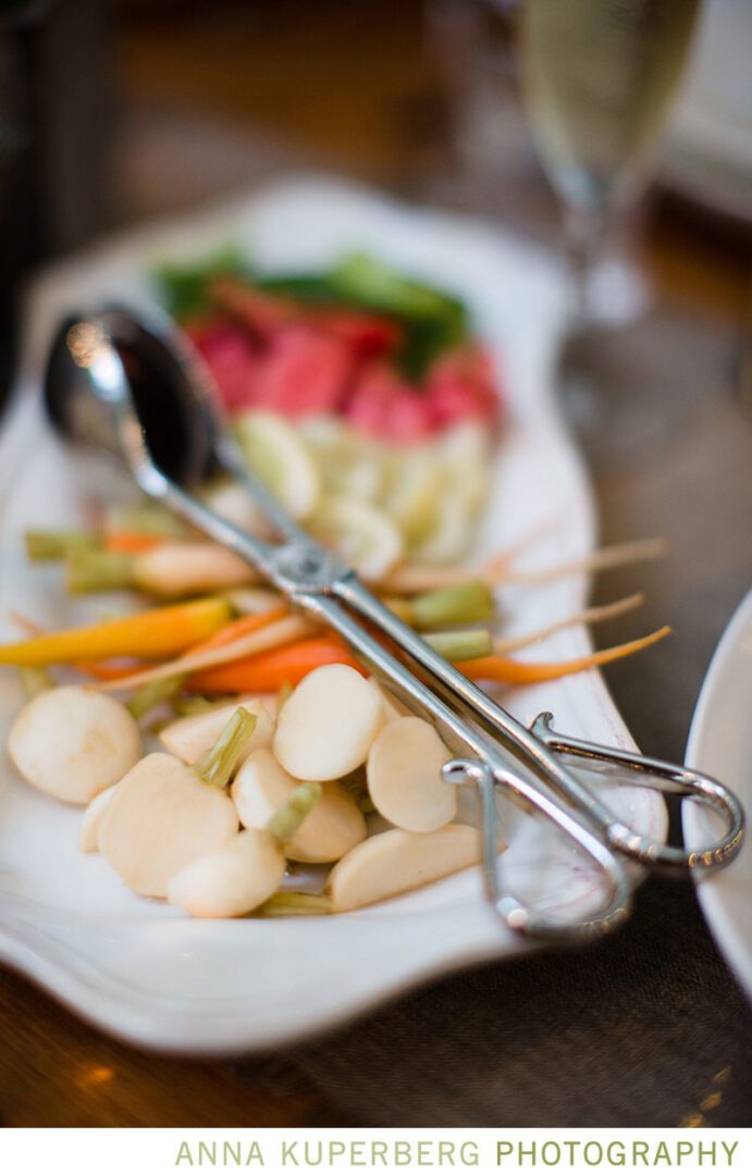 A plate of vegetables on a table.