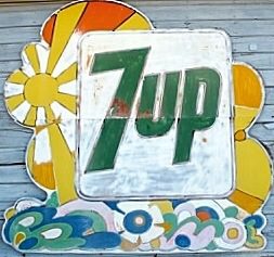 A sign with the word 7 up on it.