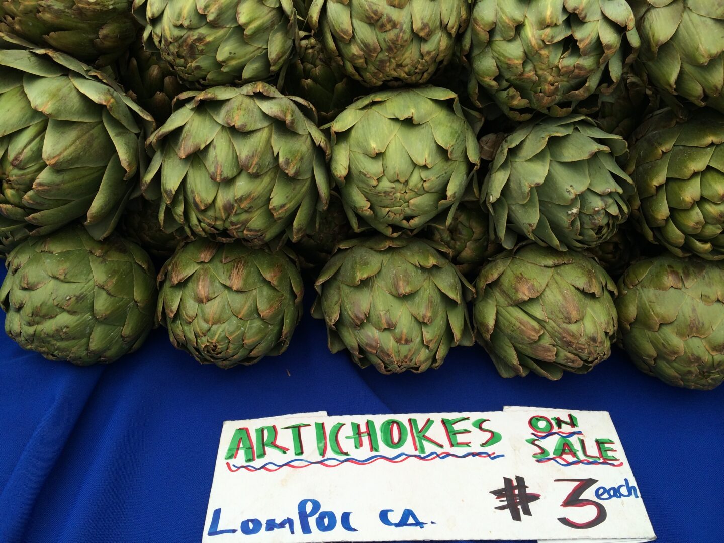 Artichokes for sale at a farmers market.