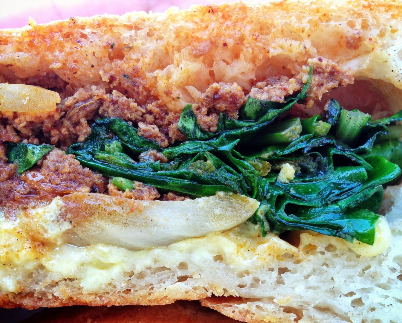 Egg,  chorizo and sauteed greens breakfast sando at Santa Monica farmer's market