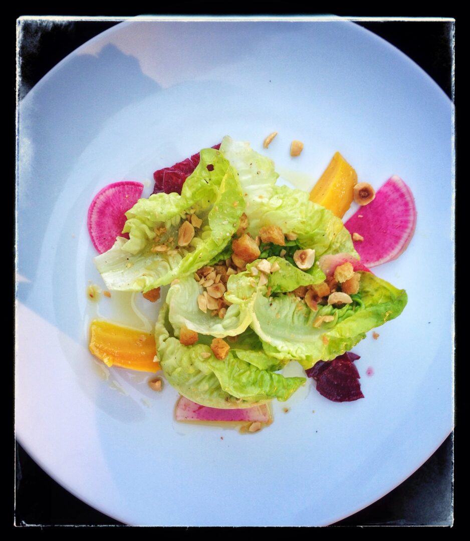 A plate with a salad on it.