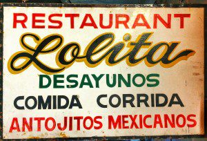 A sign that says restaurant lolita desayunos.