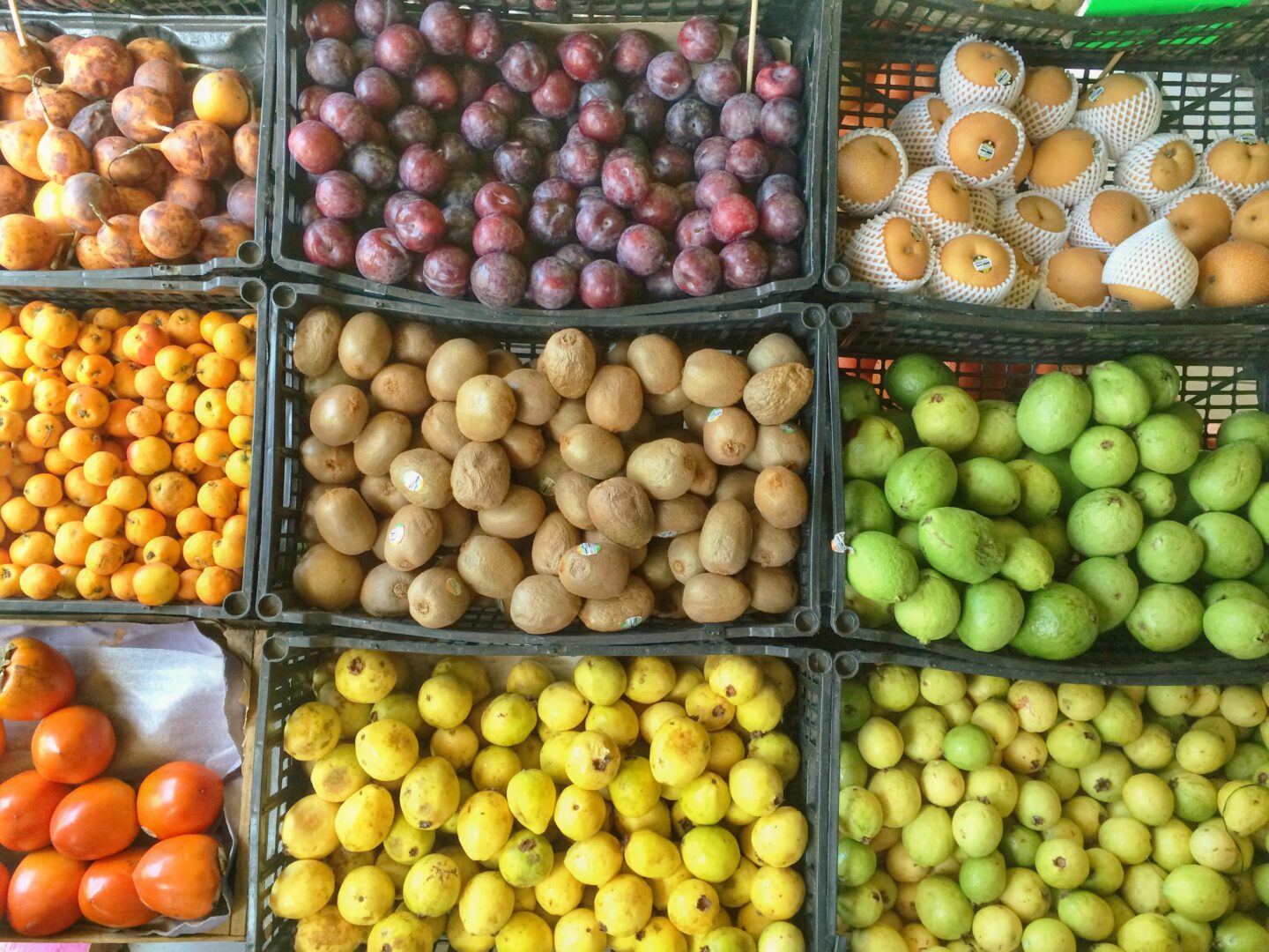 A variety of fruit in baskets.