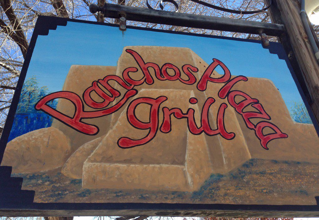 A sign that says ranchos plaza grill.