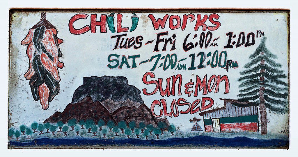 A sign that says chill works is painted on the side of a building.