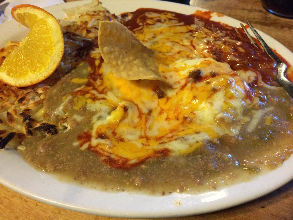 A plate of food with a tortilla and egg on it.