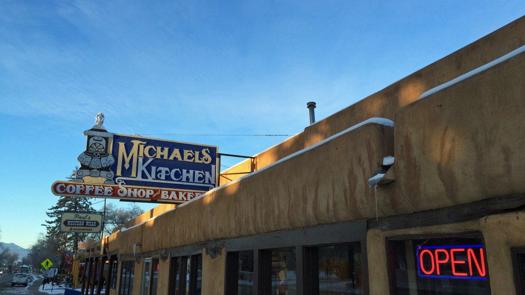 A building with a sign that says michael's coffee shop.