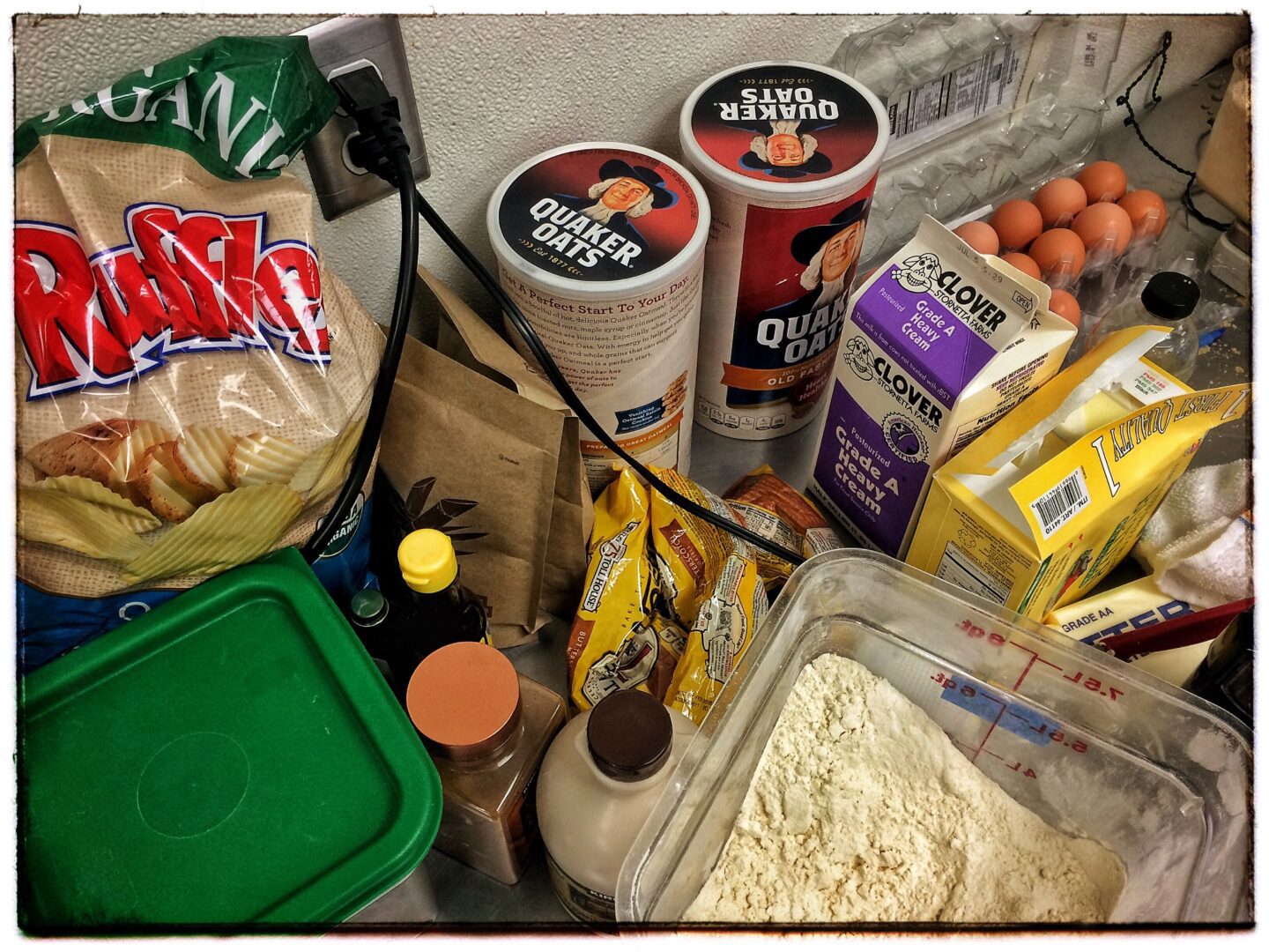 A kitchen counter with a variety of items on it.