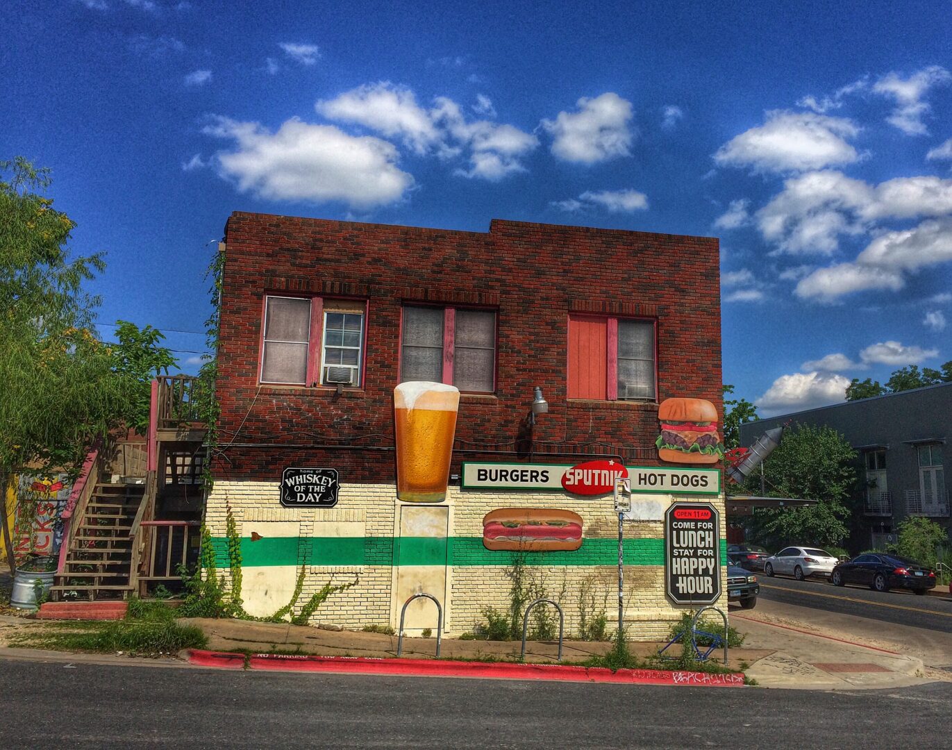 A brick building with a sign on it.