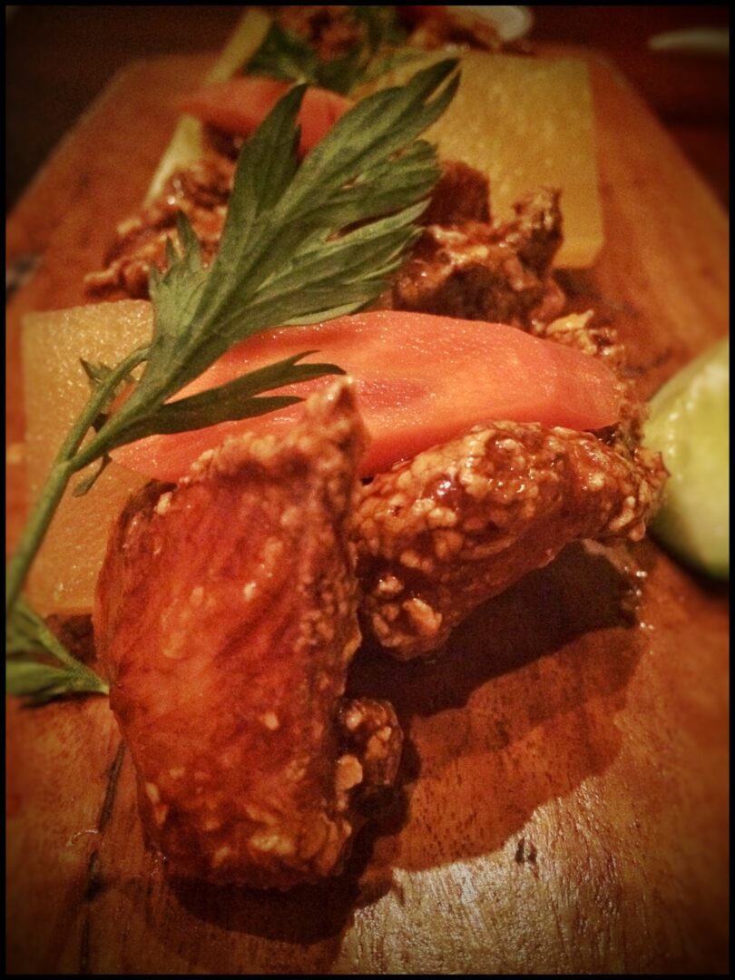 A piece of food on a wooden board.