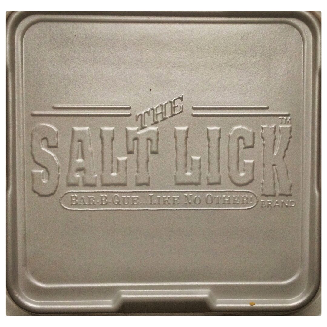 A tray with the salt lick logo on it.