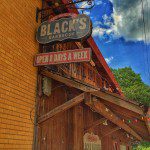 A brick building with a sign that says black's.