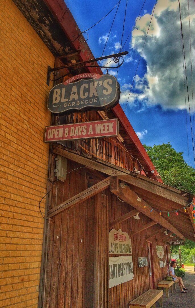 A brick building with a sign that says black's.