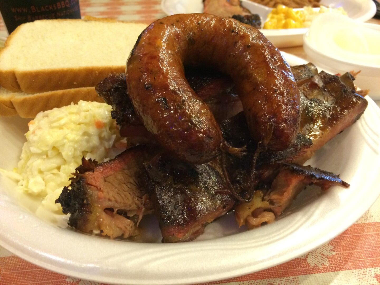 A plate of ribs and sausages.