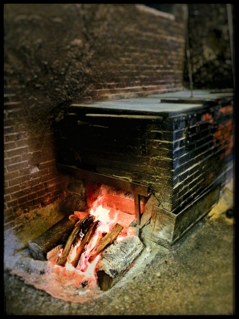 A brick oven with a fire in it.