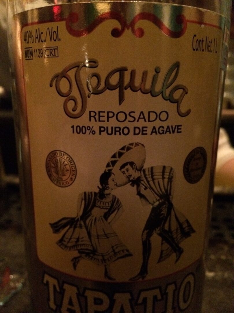 A bottle of tequila on a table.