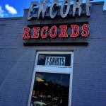 A brick building with a sign that says encore records.