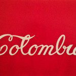 The word colombia is written on a red background.
