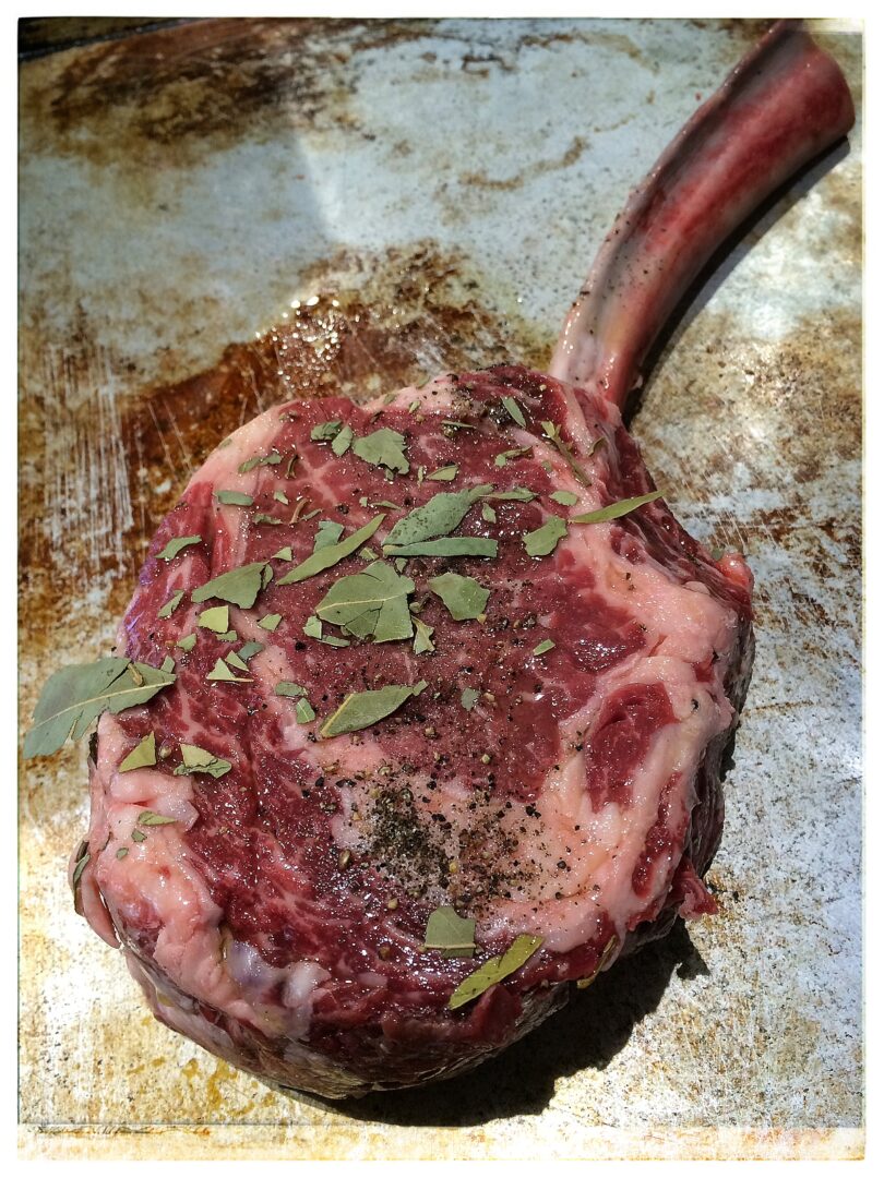 A 4 Pound Tomahawk Steak with Bay Leaf-Peppercorn Marinade