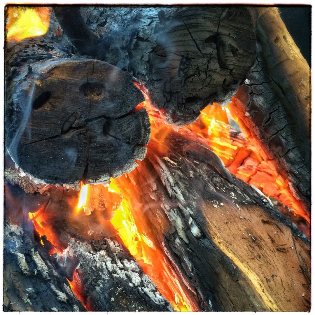 Mesquite Logs Catching Fire under the Grill