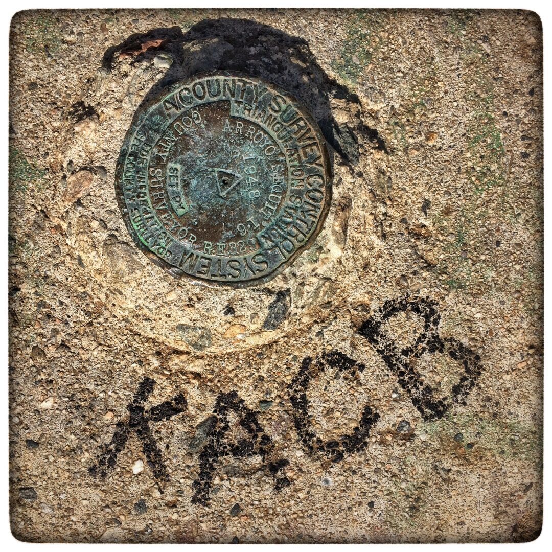 A metal plate with the word kacb written on it.