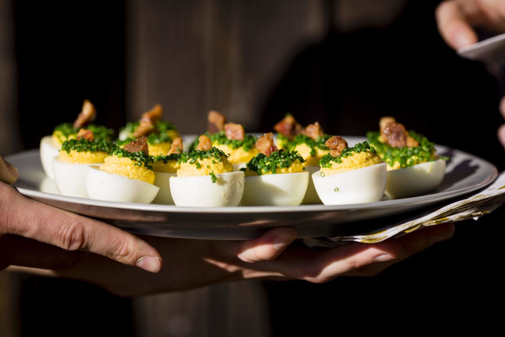 Deviled eggs served on a plate.