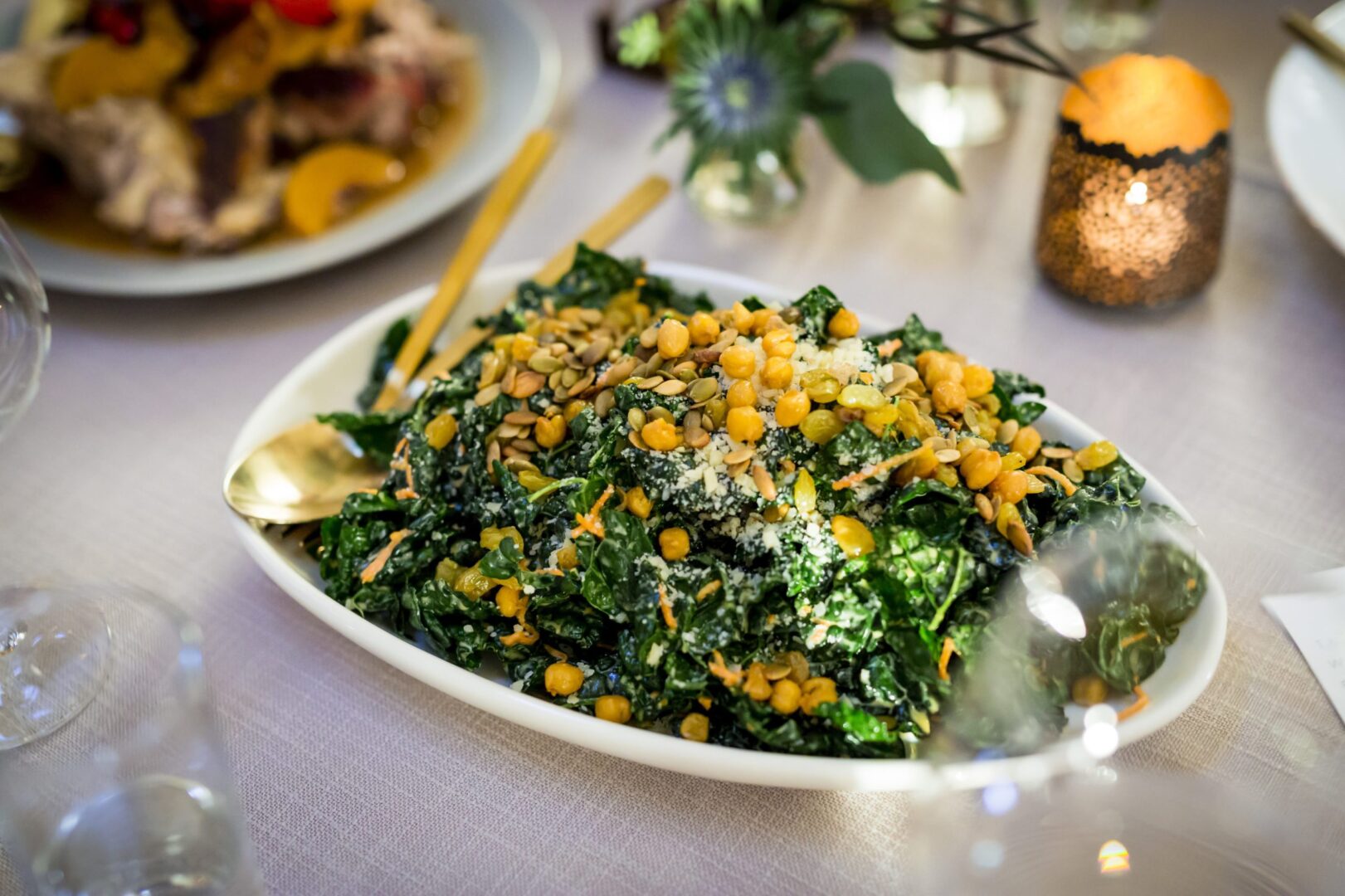Kale salad with chickpeas on a table.