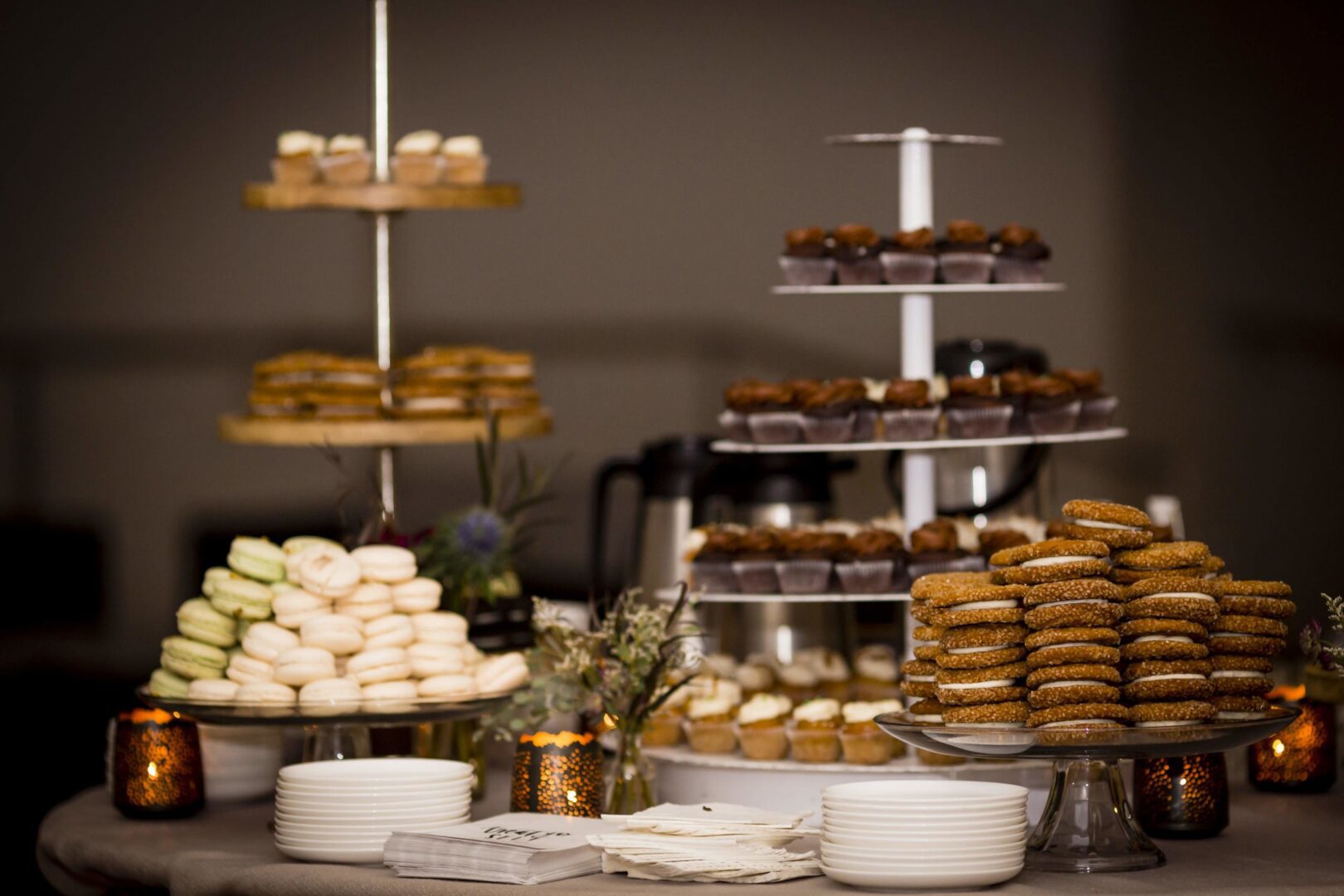 A dessert table with a variety of desserts on it.
