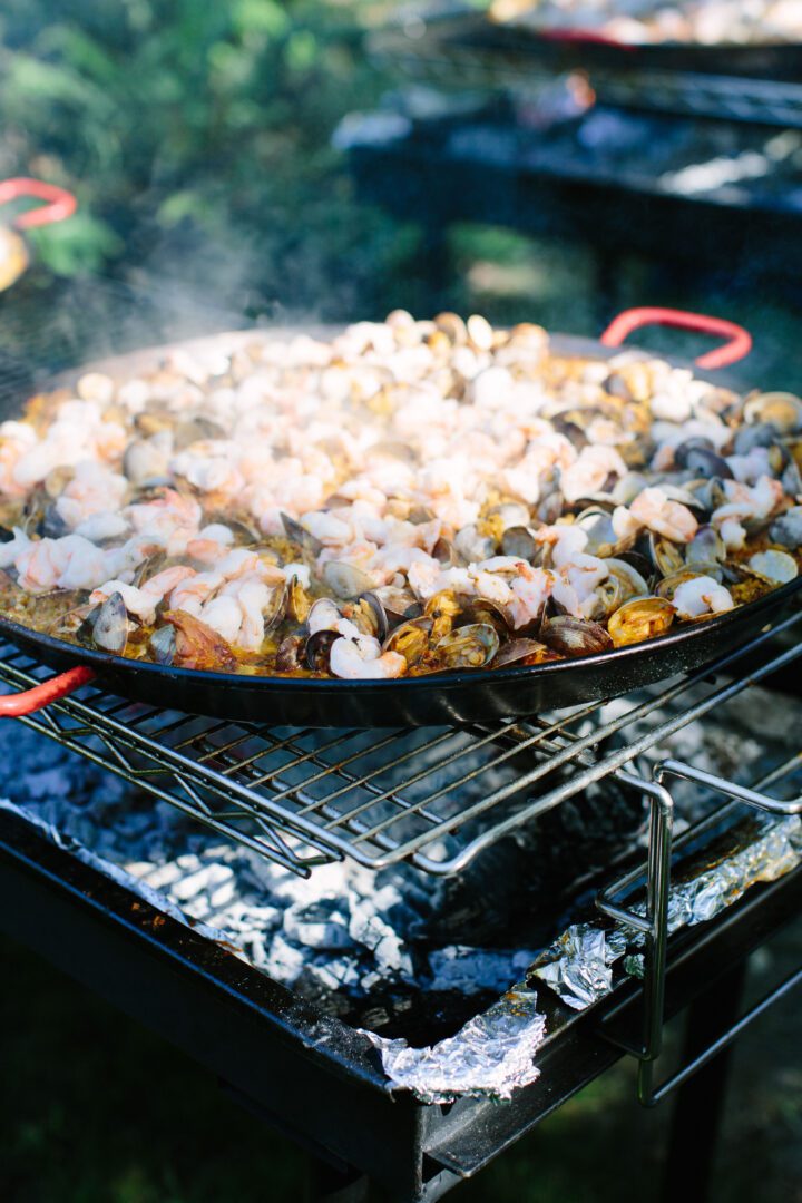 A large pan of food on a grill.