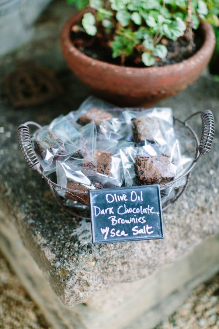 A basket of brownies with a sign on it.