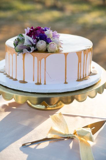 A wedding cake is sitting on top of a table.