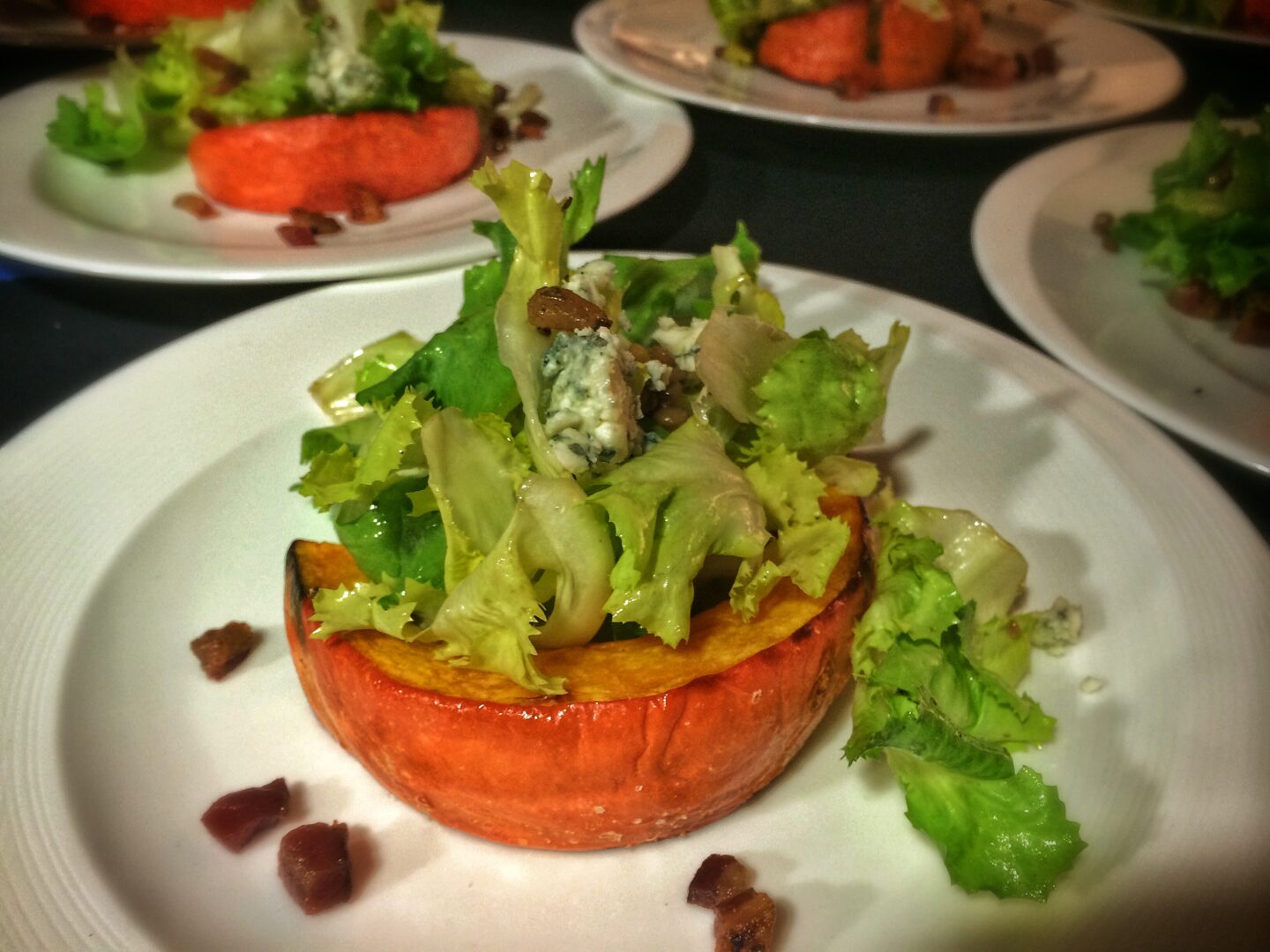 Stuffed squash salad with blue cheese and walnuts.