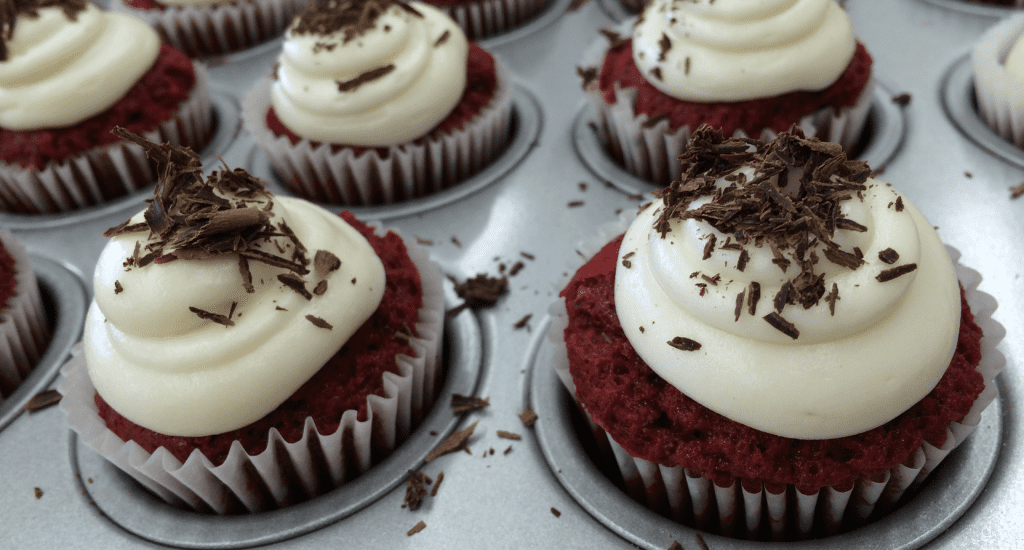 Red velvet cupcakes with cream cheese frosting.