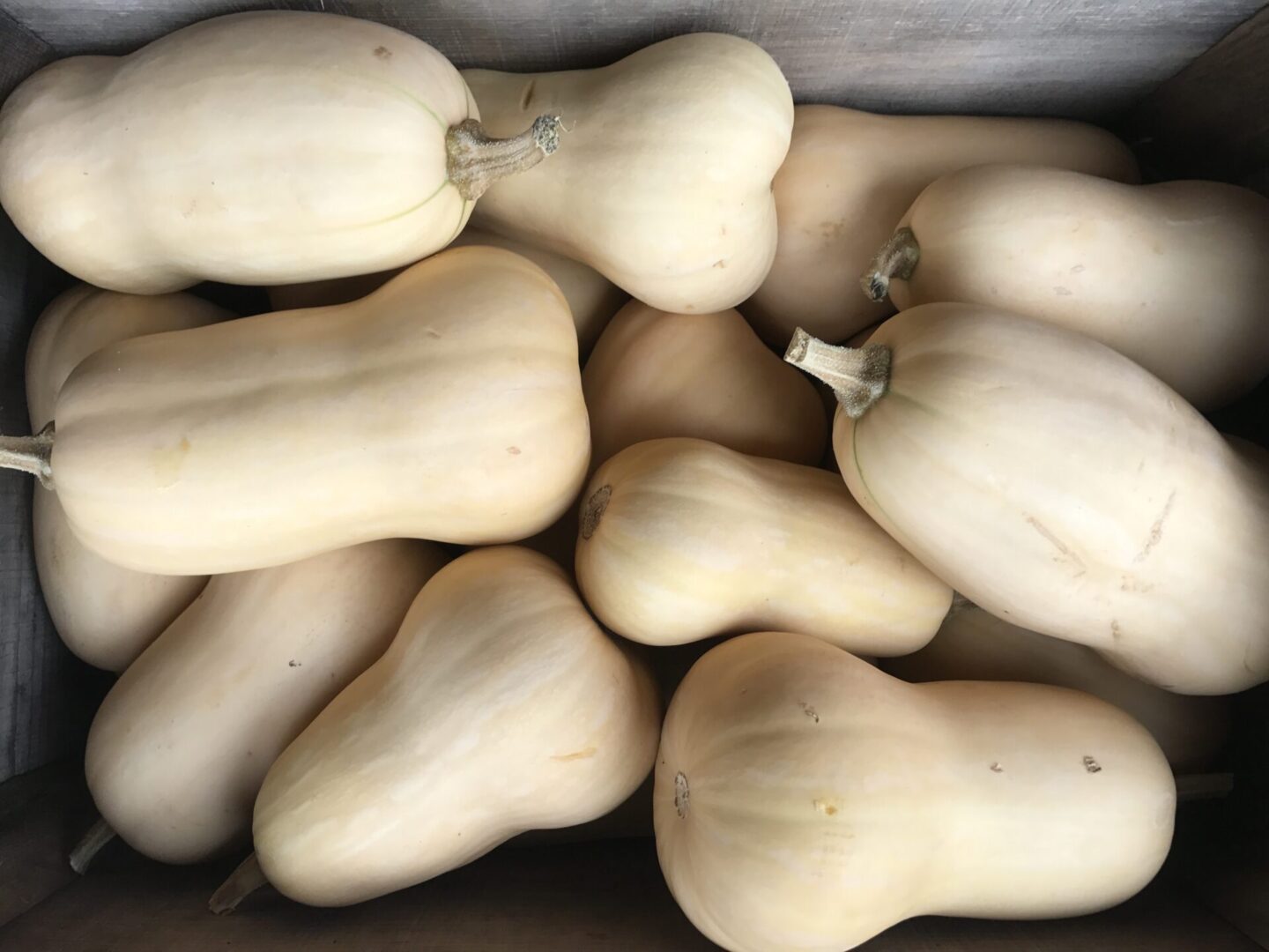 Butternut squash in a wooden box.