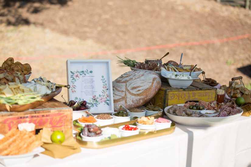 A table with a variety of food on it.