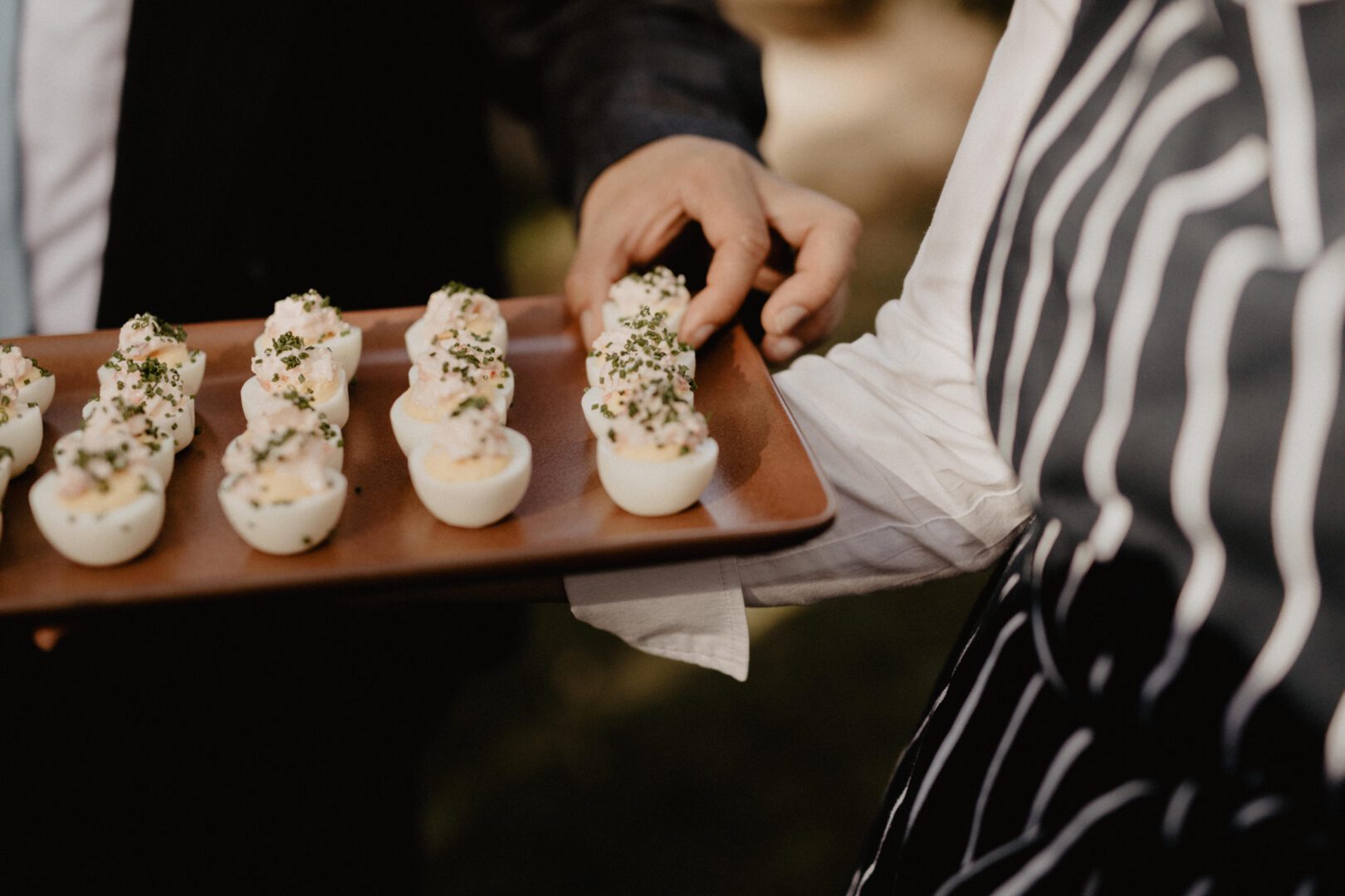 Deviled eggs served on a tray.